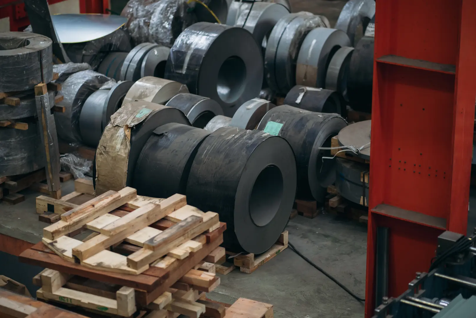 Stacks of high-quality stainless steel coils in a warehouse, ready for distribution by MFY China.